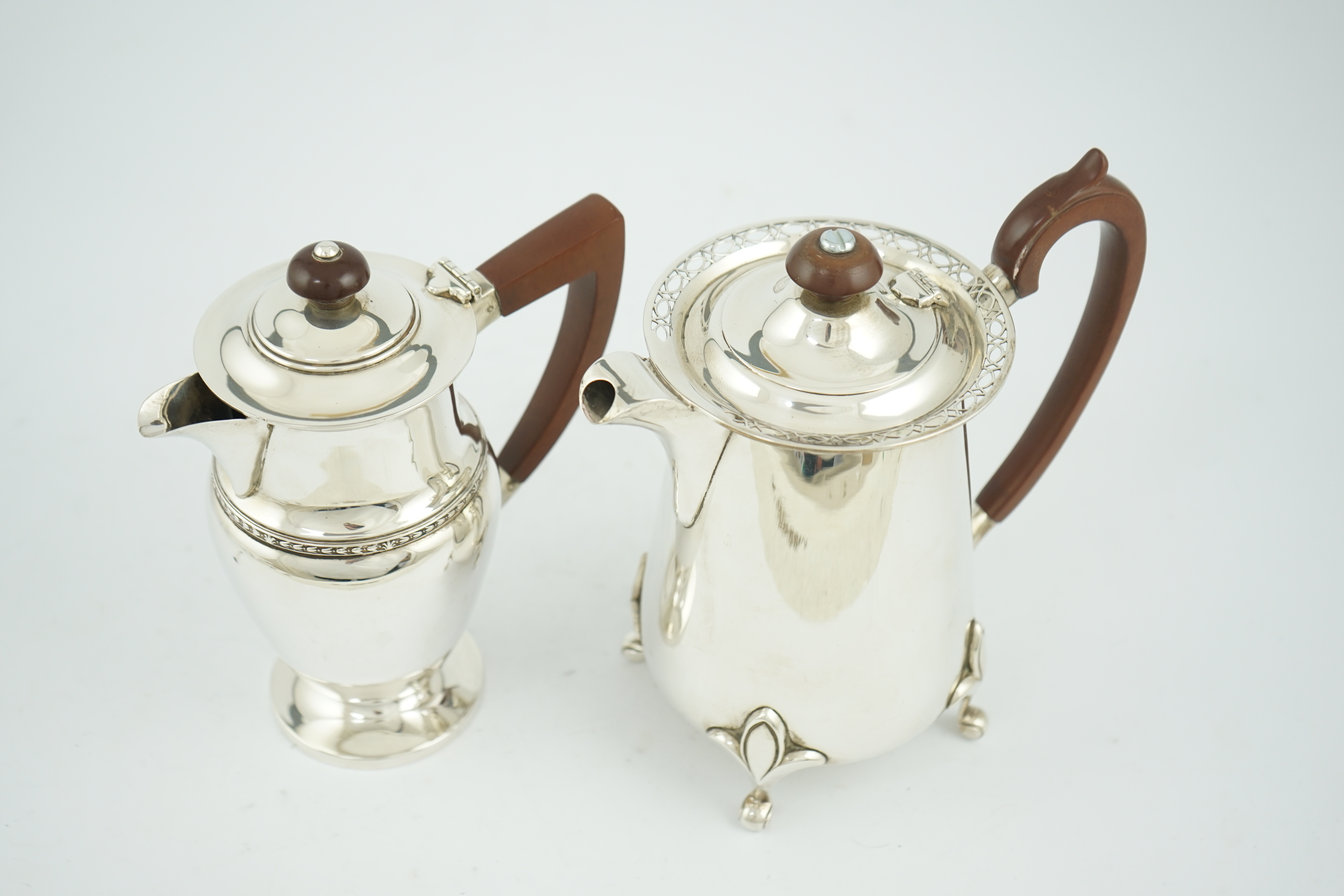 A George V silver hot water pot by Walker & Hall, Sheffield, 1925, and one other silver hot water pot by Albert Edward Jones, Birmingham, Birmingham, 1933